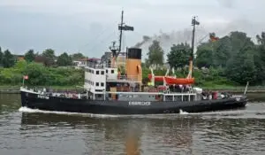 SS Stettin at speed on a river.